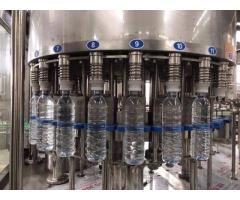 AVI Pack bottled honey, filling machines, water purifying, liquid packaging, Label conveyor